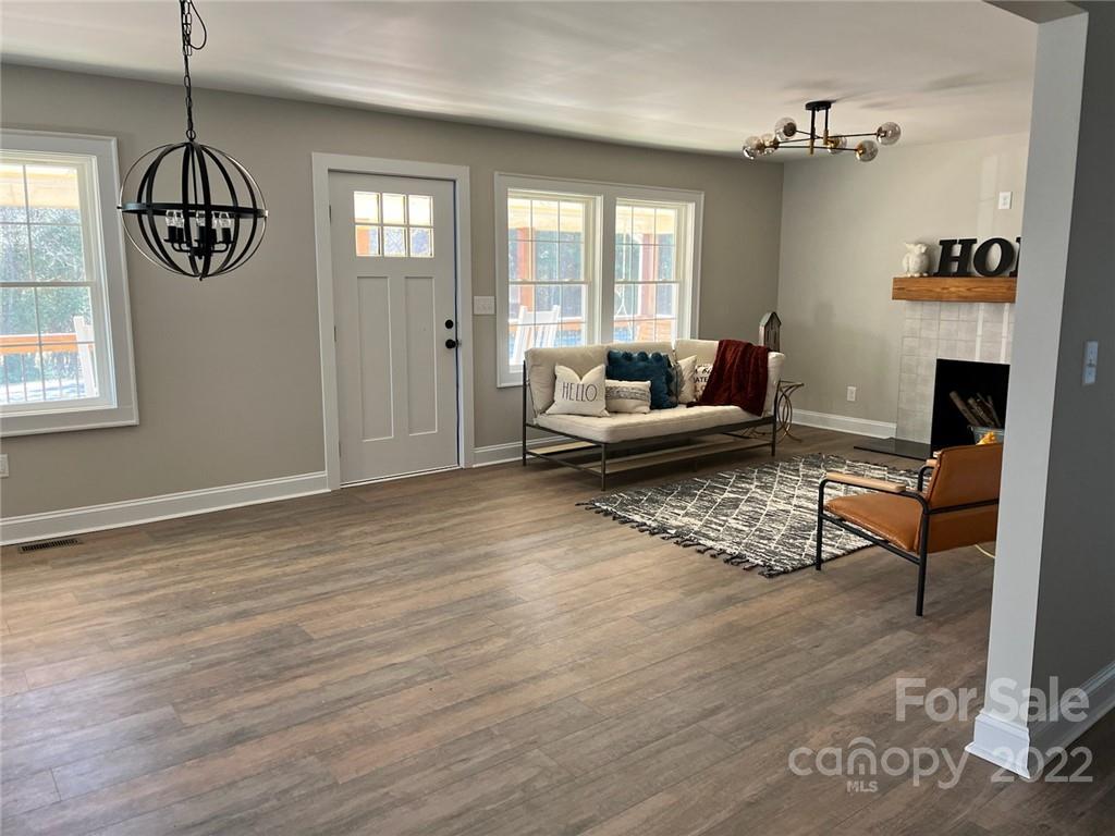 1415 Miles Road Dallas, NC 28034 - Photo 14 of 23 a living room with furniture chandelier and a window