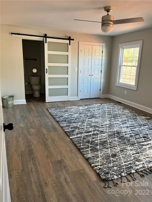 1415 Miles Road Dallas, NC 28034 - Photo 18 of 23 wooden floor in an empty room with a window