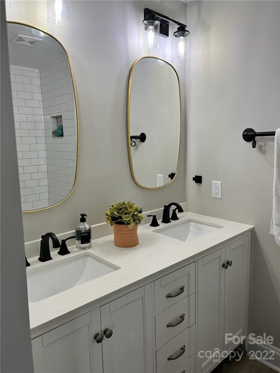 1415 Miles Road Dallas, NC 28034 - Photo 20 of 23 a bathroom with a sink double vanity and a mirror
