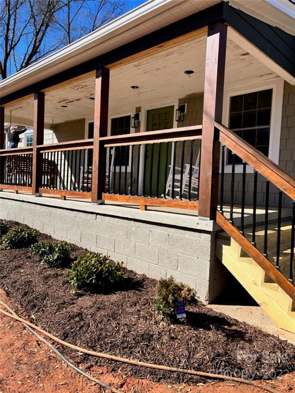 1415 Miles Road Dallas, NC 28034 - Photo 2 of 23 a view of a balcony with wooden floor and fence