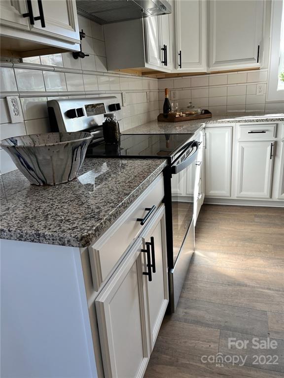 1415 Miles Road Dallas, NC 28034 - Photo 8 of 23 a kitchen with stainless steel appliances granite countertop a sink stove and cabinets