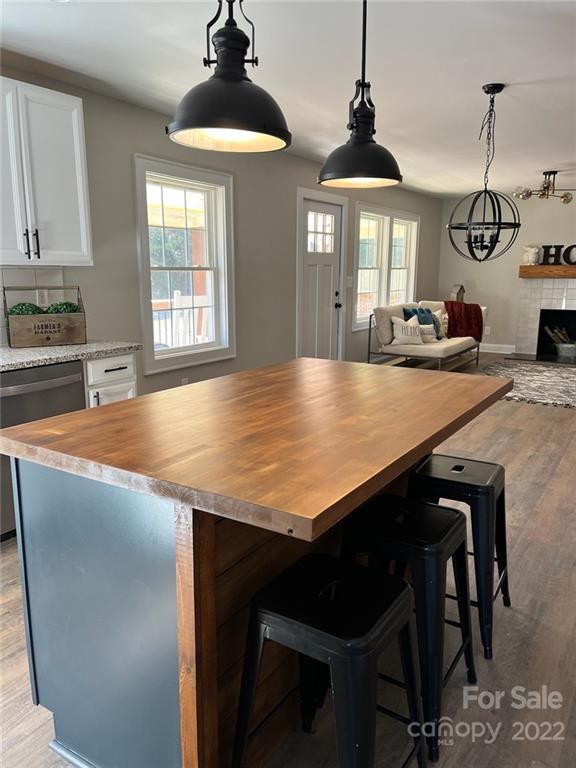 1415 Miles Road Dallas, NC 28034 - Photo 9 of 23 a view of a kitchen with a table and chairs