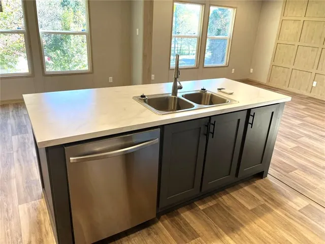 a kitchen with a sink and a window