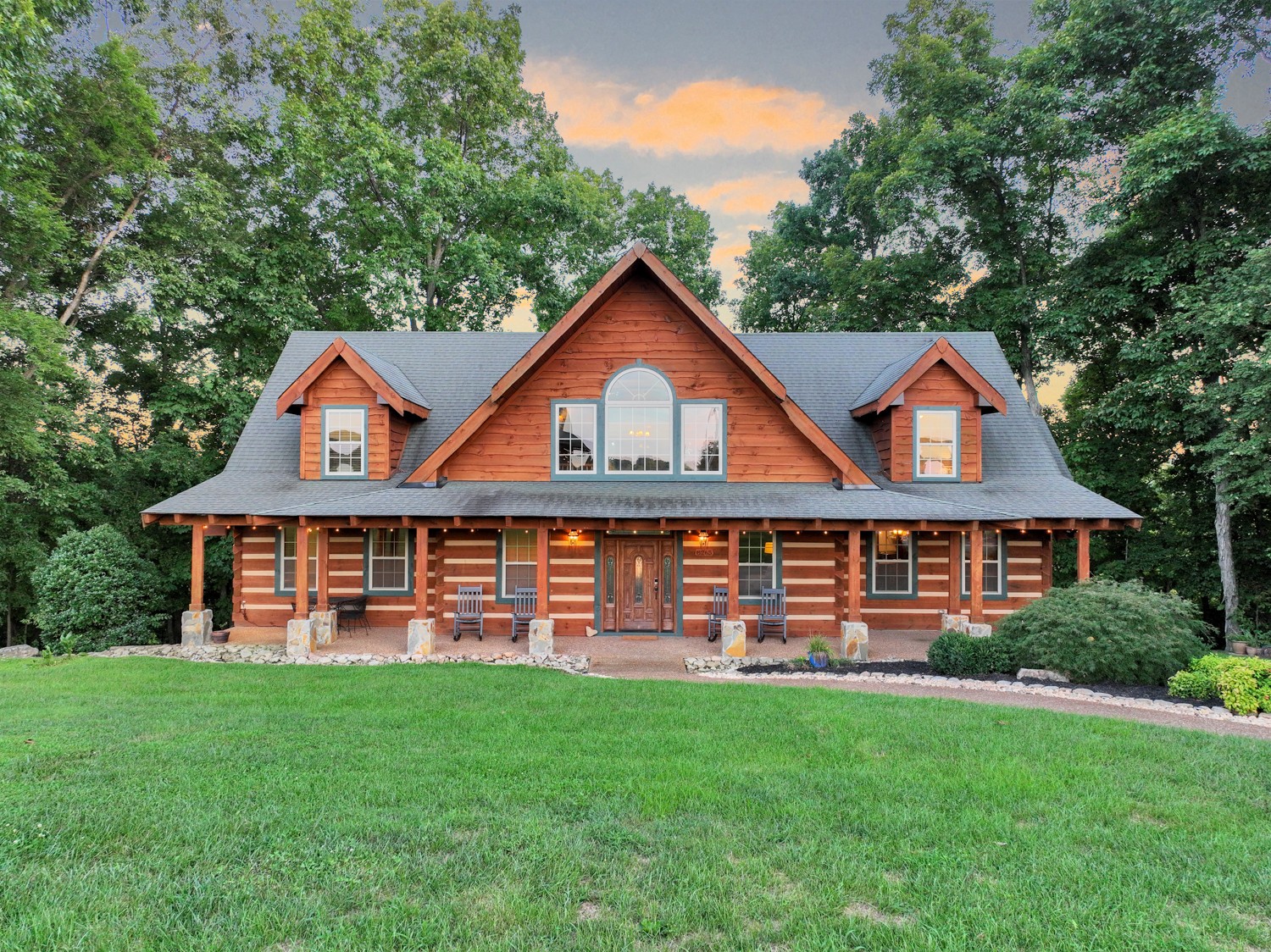 8265 Guthrie Road Cross Plains, TN 37049 - Photo 11 of 83 a front view of a house with a yard and trees