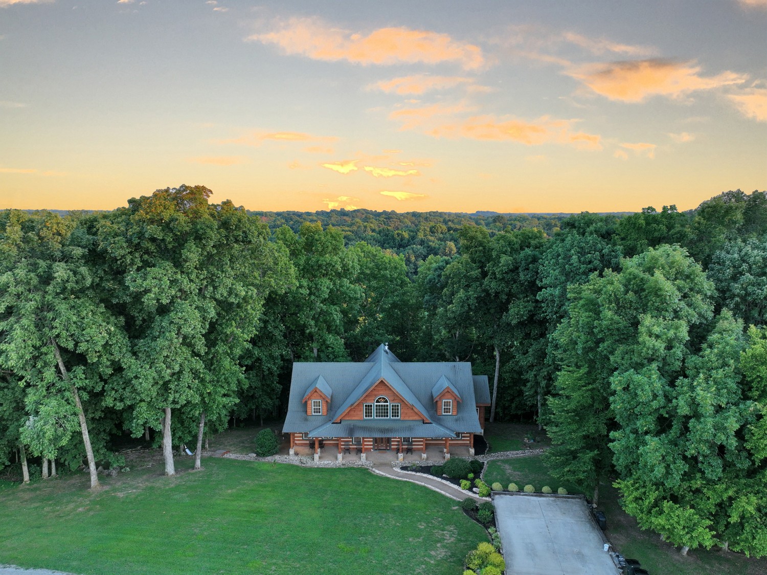 8265 Guthrie Road Cross Plains, TN 37049 - Photo 2 of 83 a view of a big house with a big yard and large trees