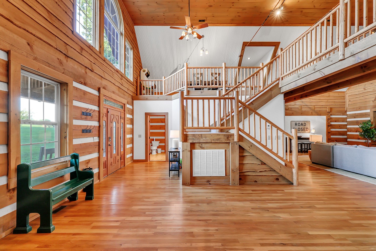 8265 Guthrie Road Cross Plains, TN 37049 - Photo 27 of 83 a view of staircase with lots of frames on wall and a large window
