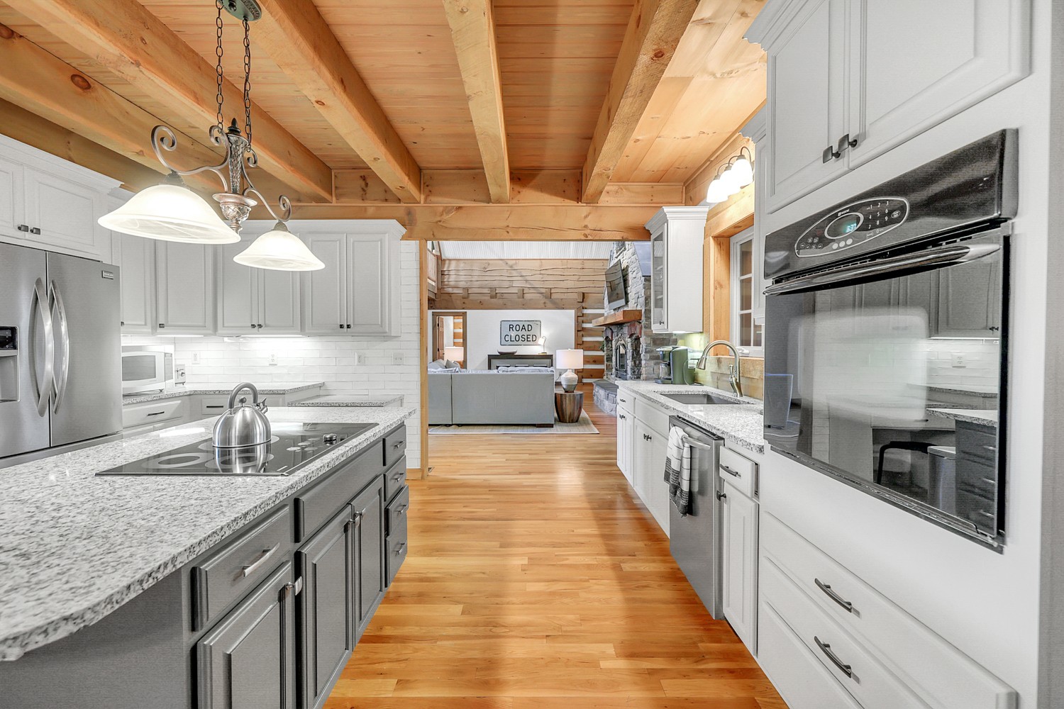8265 Guthrie Road Cross Plains, TN 37049 - Photo 37 of 83 a large kitchen with stainless steel appliances kitchen island granite countertop a large counter top a stove and a sink