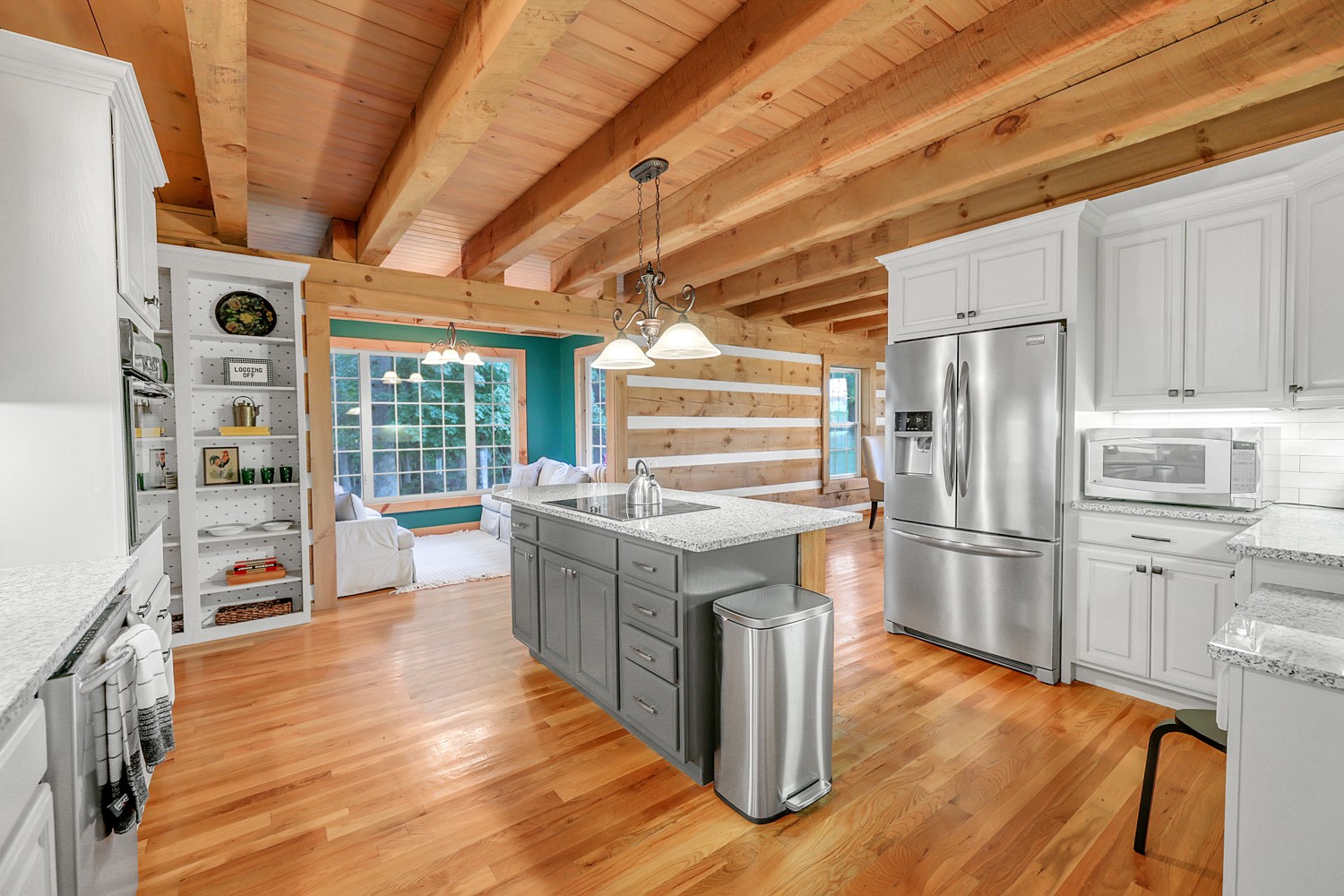8265 Guthrie Road Cross Plains, TN 37049 - Photo 38 of 83 a kitchen with stainless steel appliances granite countertop a stove a refrigerator and a wooden floors