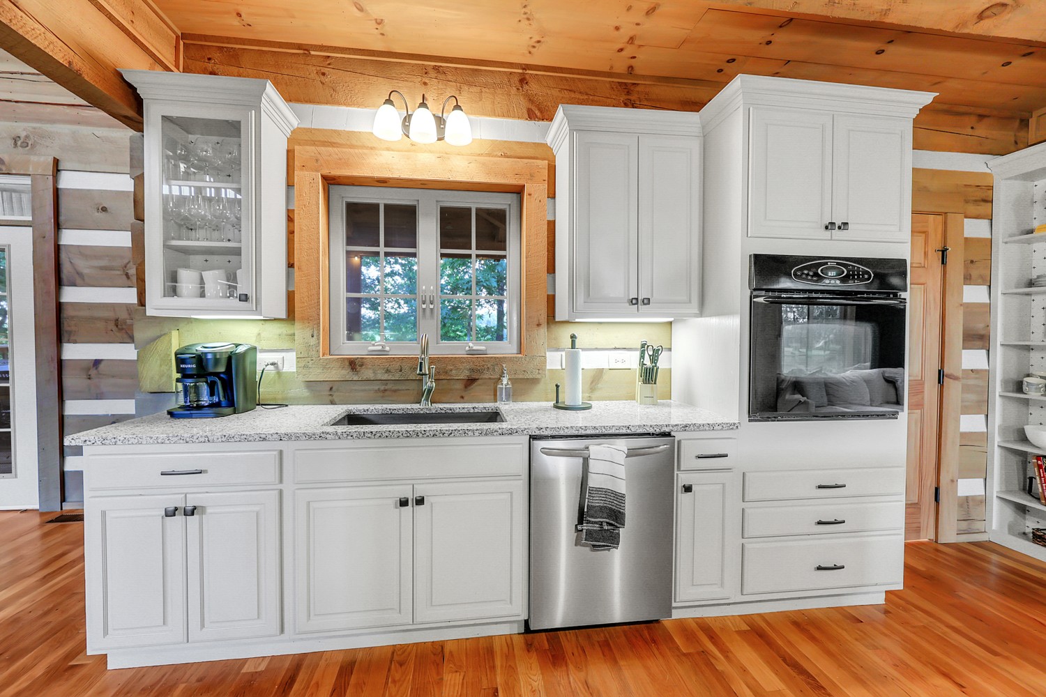 8265 Guthrie Road Cross Plains, TN 37049 - Photo 39 of 83 a kitchen with granite countertop a sink and cabinets