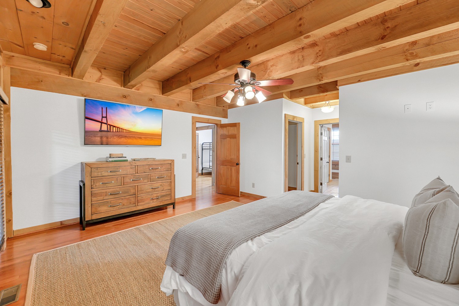 8265 Guthrie Road Cross Plains, TN 37049 - Photo 42 of 83 a bedroom with a bed a dresser and chandelier