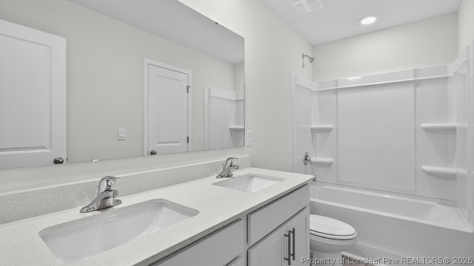 194 Fair Child Road Spring Lake, NC 28390 - Photo 27 of 33 a bathroom with a sink double vanity granite toilet tub and shower