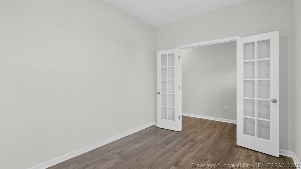 194 Fair Child Road Spring Lake, NC 28390 - Photo 3 of 33 a view of an empty room with wooden floor