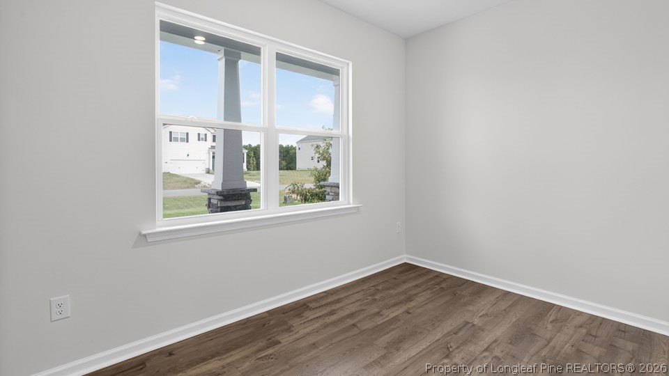 194 Fair Child Road Spring Lake, NC 28390 - Photo 4 of 33 a view of an empty room with wooden floor and a window