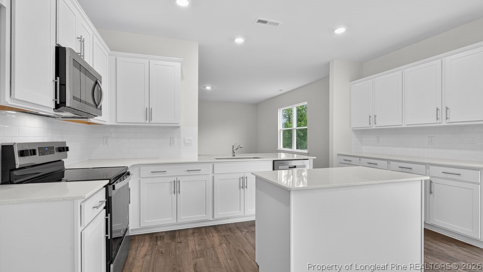 194 Fair Child Road Spring Lake, NC 28390 - Photo 7 of 33 a kitchen with stainless steel appliances granite countertop a sink stove and cabinets