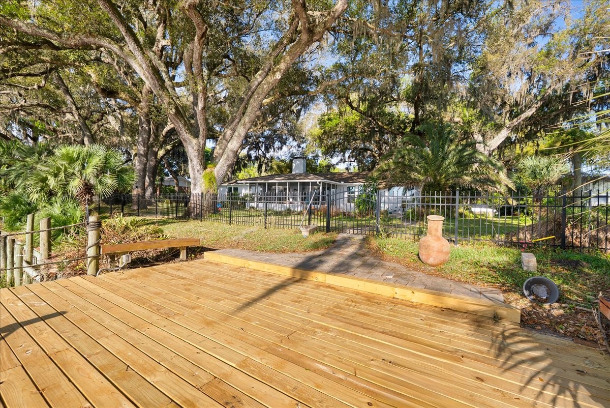 85316 Avant Road Yulee, FL 32097 - Photo 53 of 62 a view of a swimming pool with an outdoor space and seating area