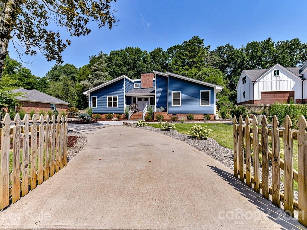 305 Boyce Road Charlotte, NC 28211 - Photo 2 of 48 a front view of a house with a yard