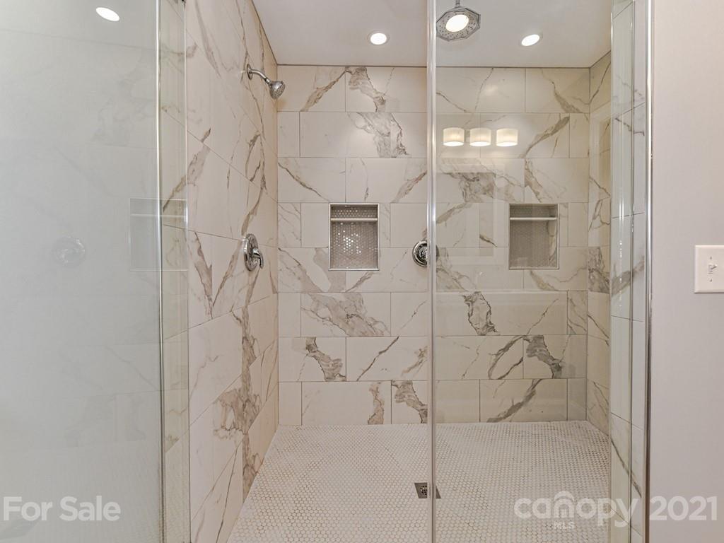305 Boyce Road Charlotte, NC 28211 - Photo 22 of 48 a bathroom with a shower