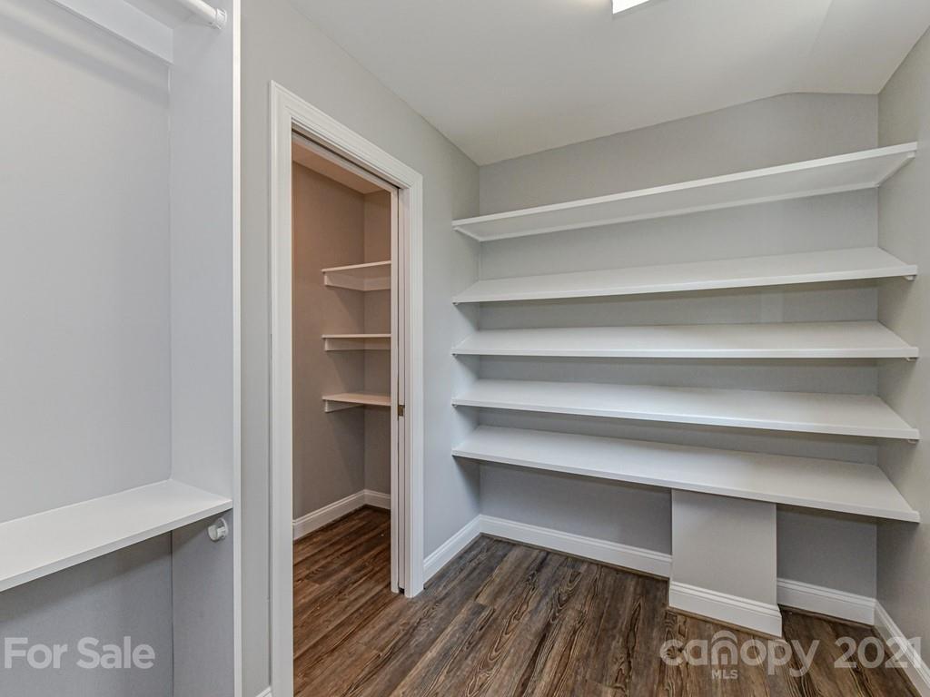 305 Boyce Road Charlotte, NC 28211 - Photo 23 of 48 a view of walk in closet with empty racks