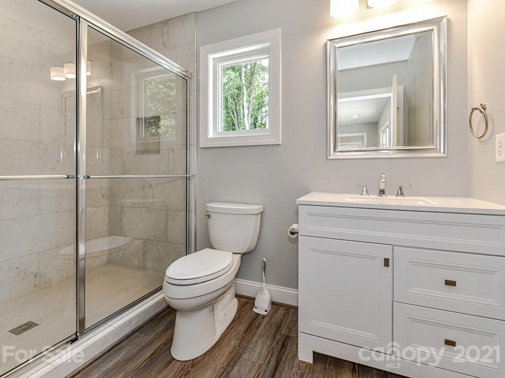 305 Boyce Road Charlotte, NC 28211 - Photo 29 of 48 a bathroom with a sink toilet and shower