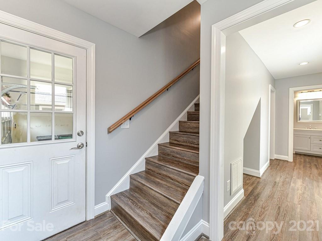 305 Boyce Road Charlotte, NC 28211 - Photo 30 of 48 a view of staircase with wooden floor and floors