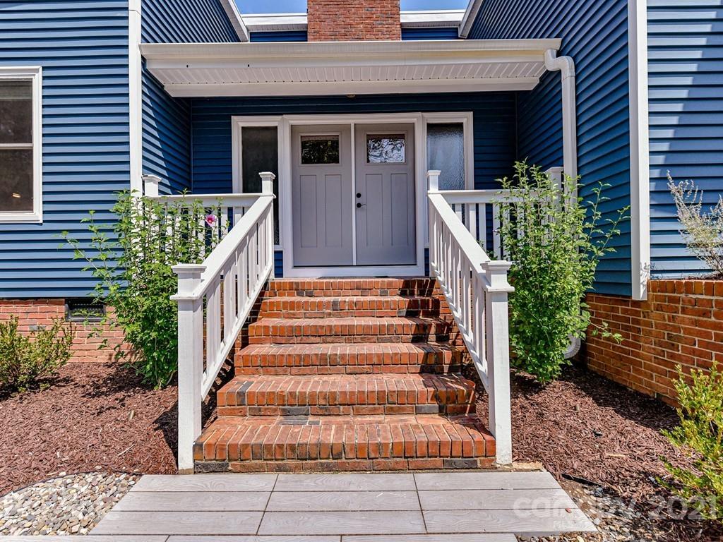 305 Boyce Road Charlotte, NC 28211 - Photo 4 of 48 a front view of a house with windows and plants