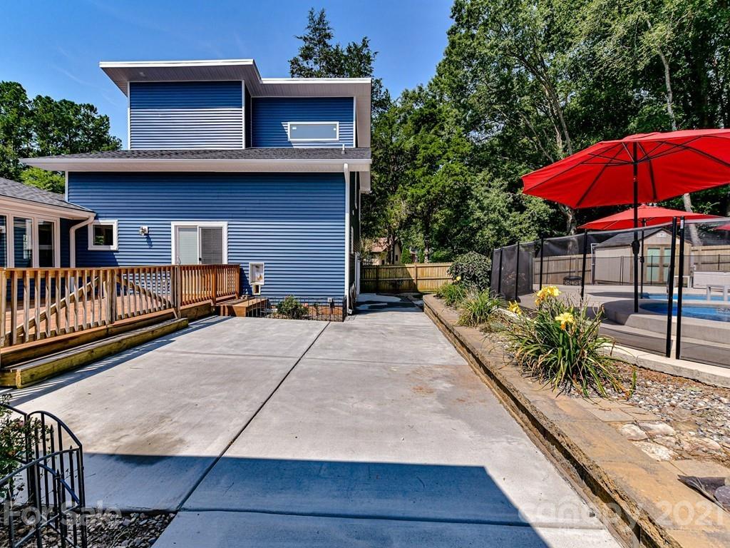 305 Boyce Road Charlotte, NC 28211 - Photo 34 of 48 a view of a house with backyard and sitting area