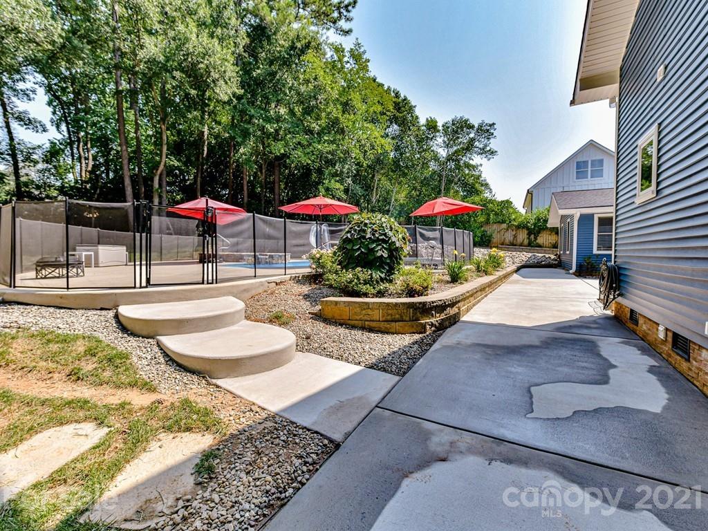 305 Boyce Road Charlotte, NC 28211 - Photo 35 of 48 a view of a house with swimming pool and furniture