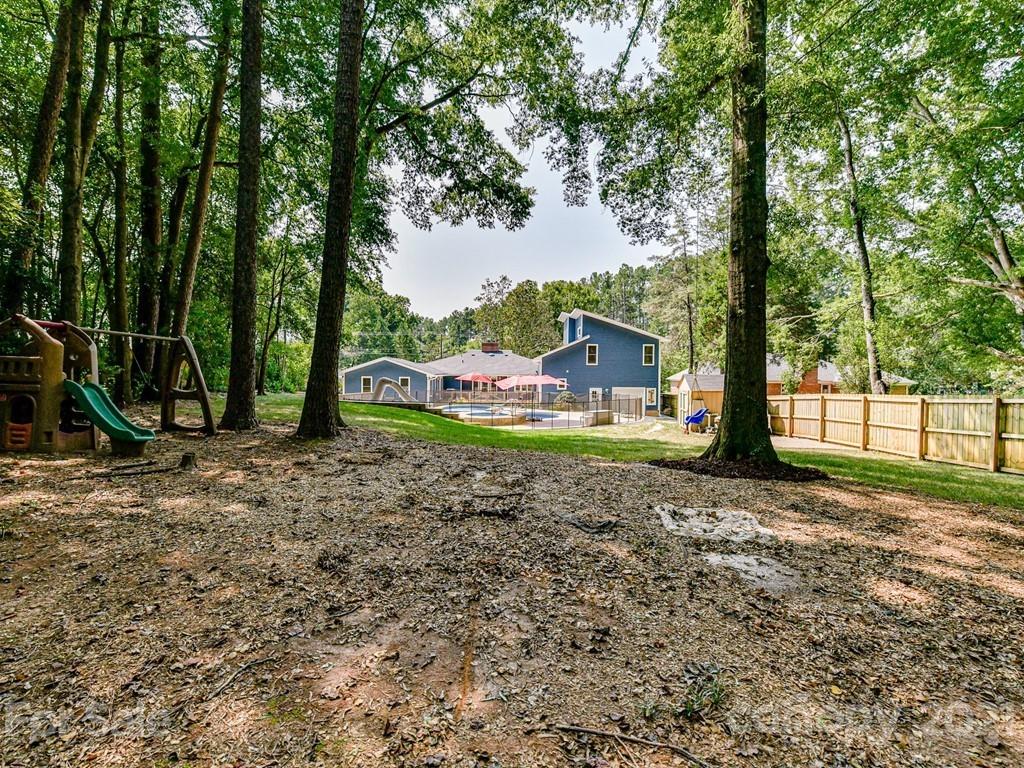 305 Boyce Road Charlotte, NC 28211 - Photo 48 of 48 a backyard of a house with lots of green space