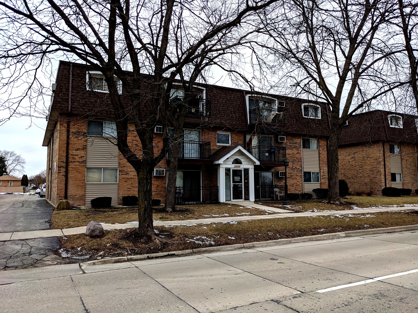10440 South Ridgeland Avenue, Unit 5 Chicago Ridge, IL 60415 - Photo 1 of 27 a front view of a house with a tree