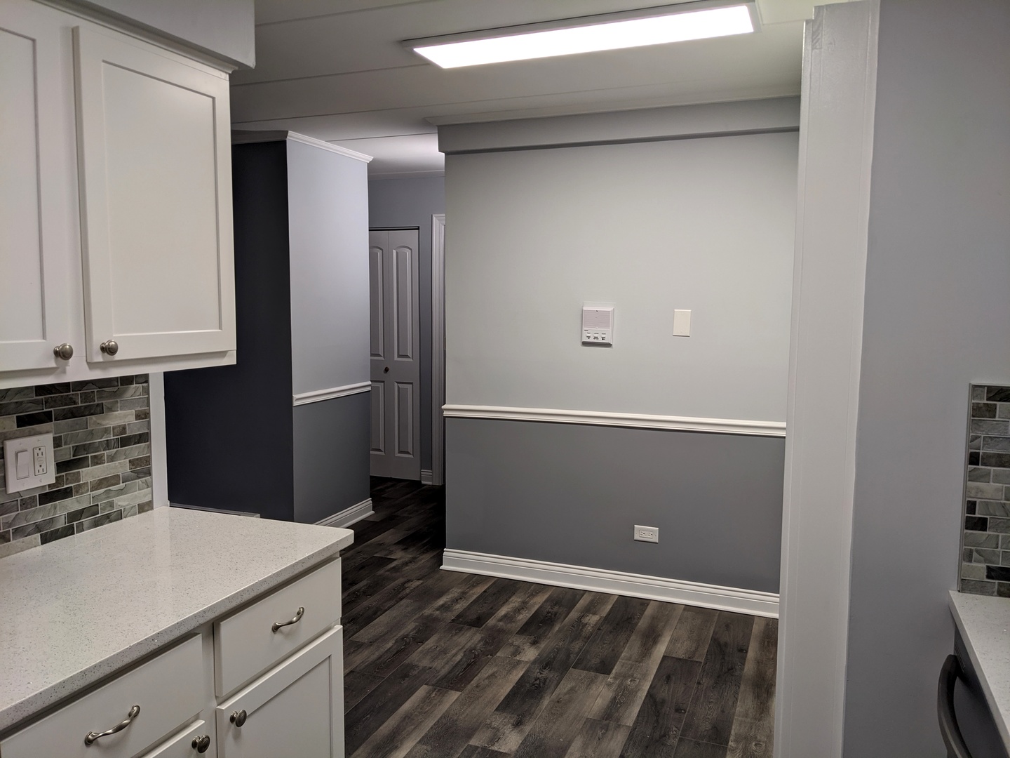 10440 South Ridgeland Avenue, Unit 5 Chicago Ridge, IL 60415 - Photo 17 of 27 a kitchen with cabinets and wooden floor