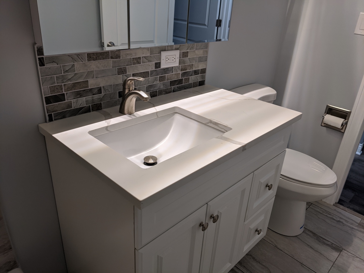 10440 South Ridgeland Avenue, Unit 5 Chicago Ridge, IL 60415 - Photo 22 of 27 a close view of a sink and a toilet in a bathroom