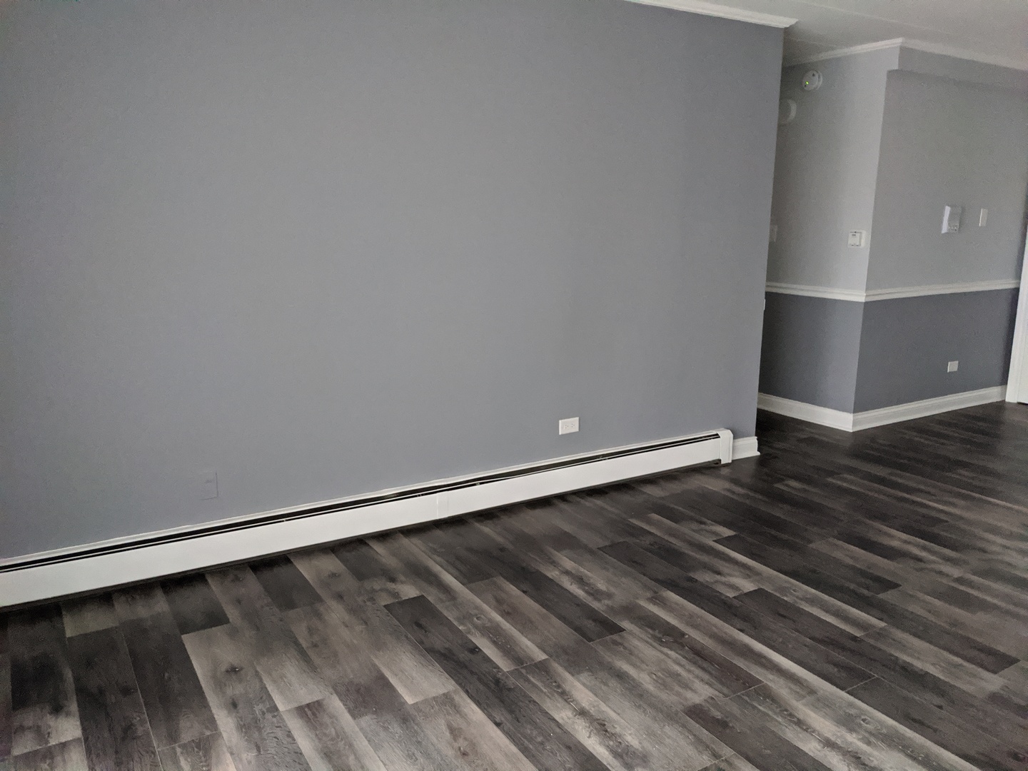 10440 South Ridgeland Avenue, Unit 5 Chicago Ridge, IL 60415 - Photo 7 of 27 a view of an empty room with wooden floor