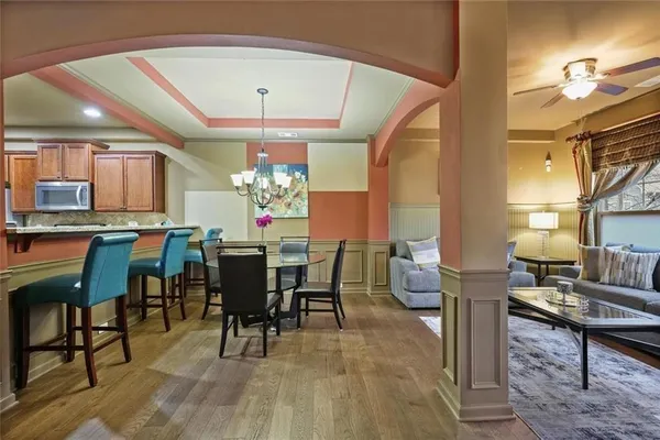 a view of a dining room with furniture and wooden floor