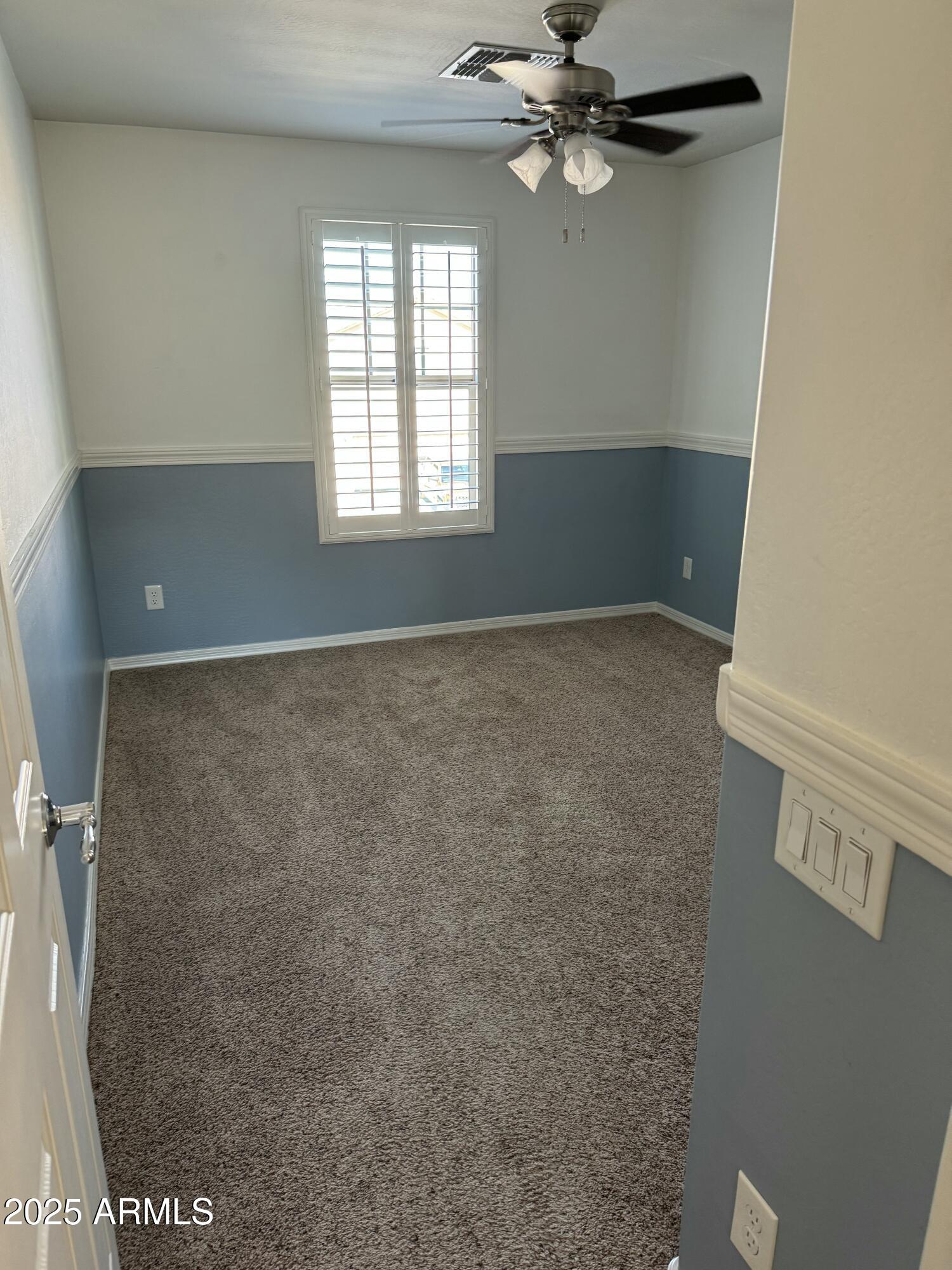 11009 East Sutter Avenue Mesa, AZ 85212 - Photo 25 of 32 a view of an empty room with a window