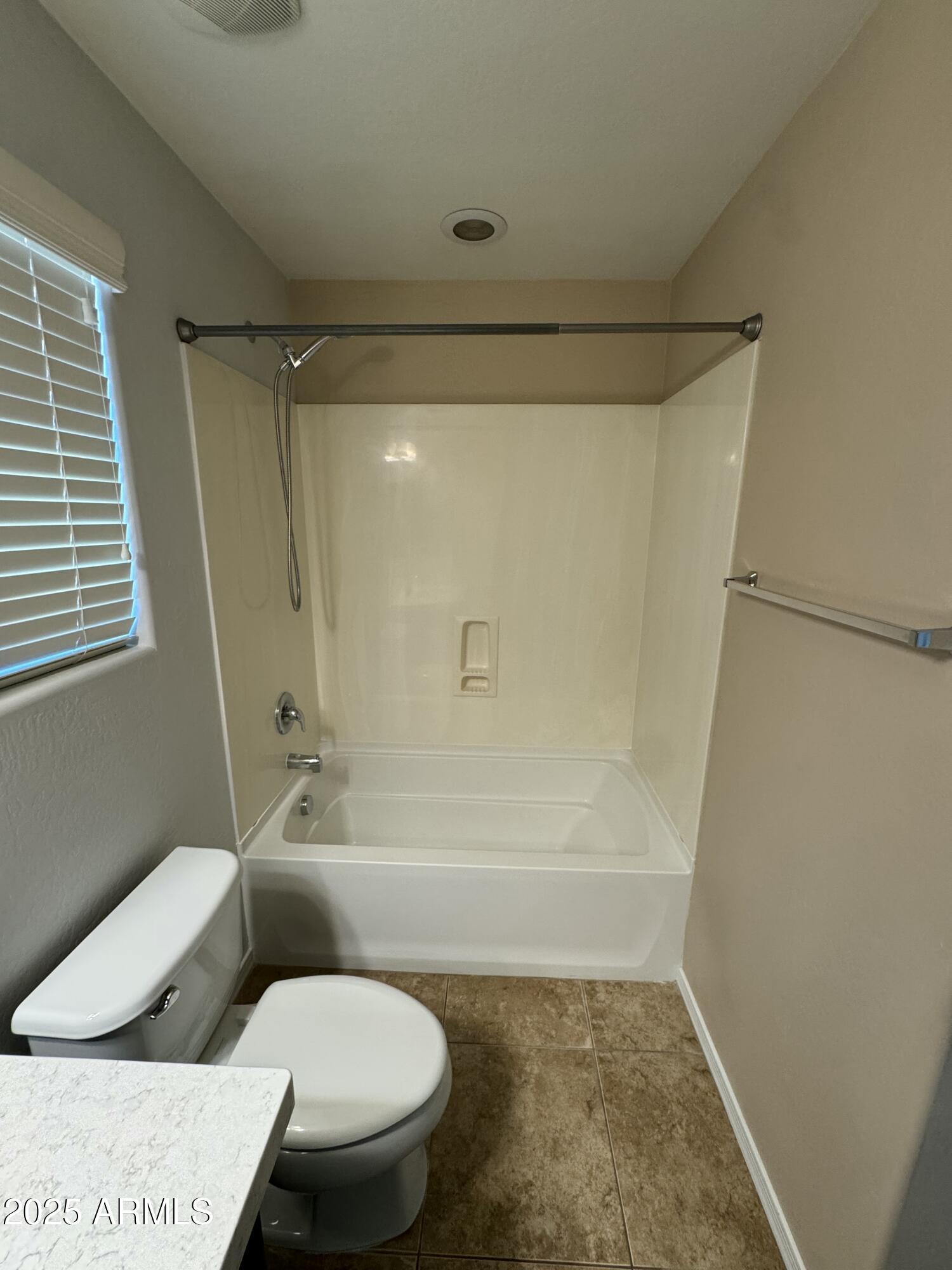 11009 East Sutter Avenue Mesa, AZ 85212 - Photo 27 of 32 a bathroom with a toilet and a shower