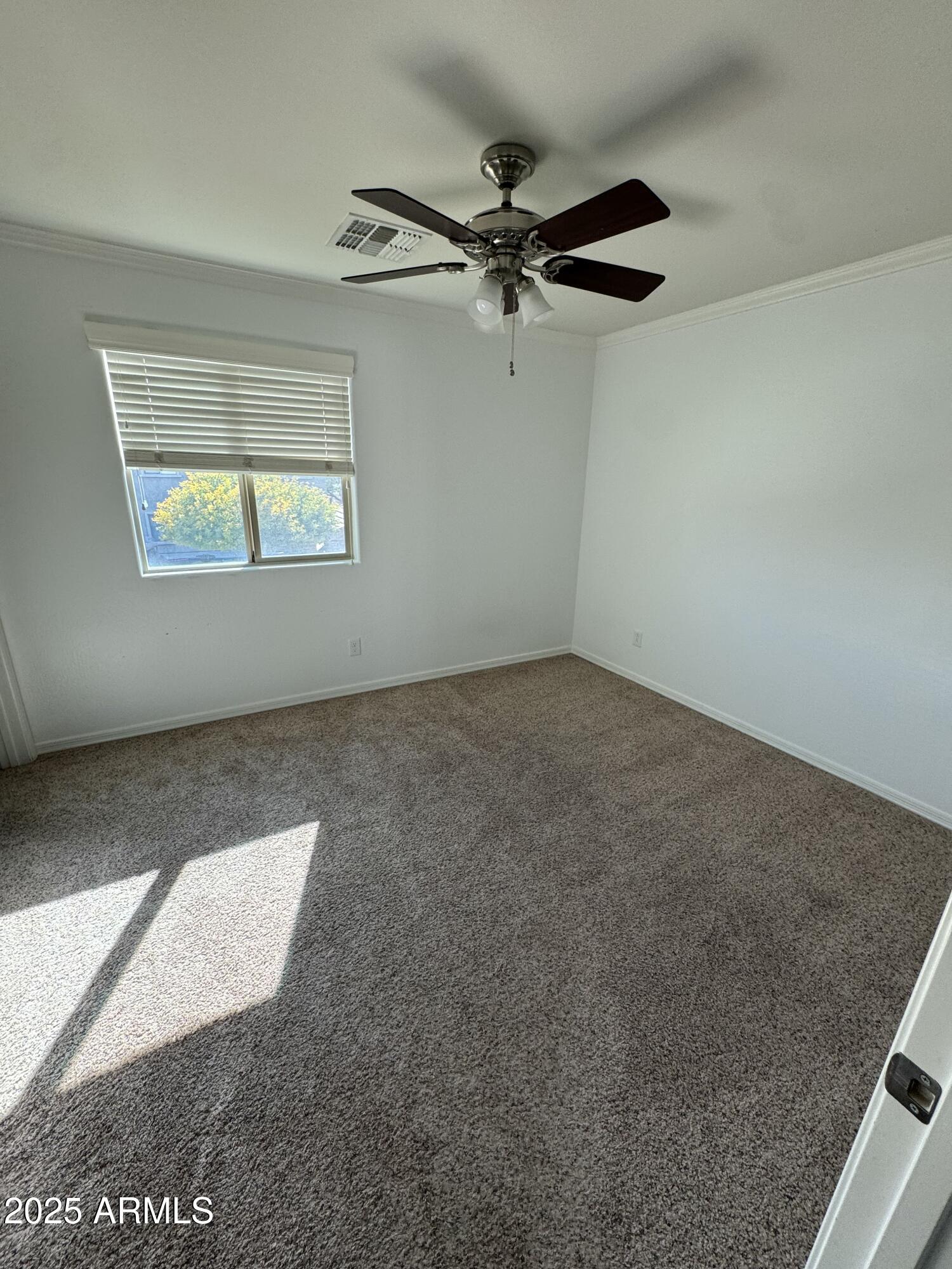 11009 East Sutter Avenue Mesa, AZ 85212 - Photo 28 of 32 an empty room with a window