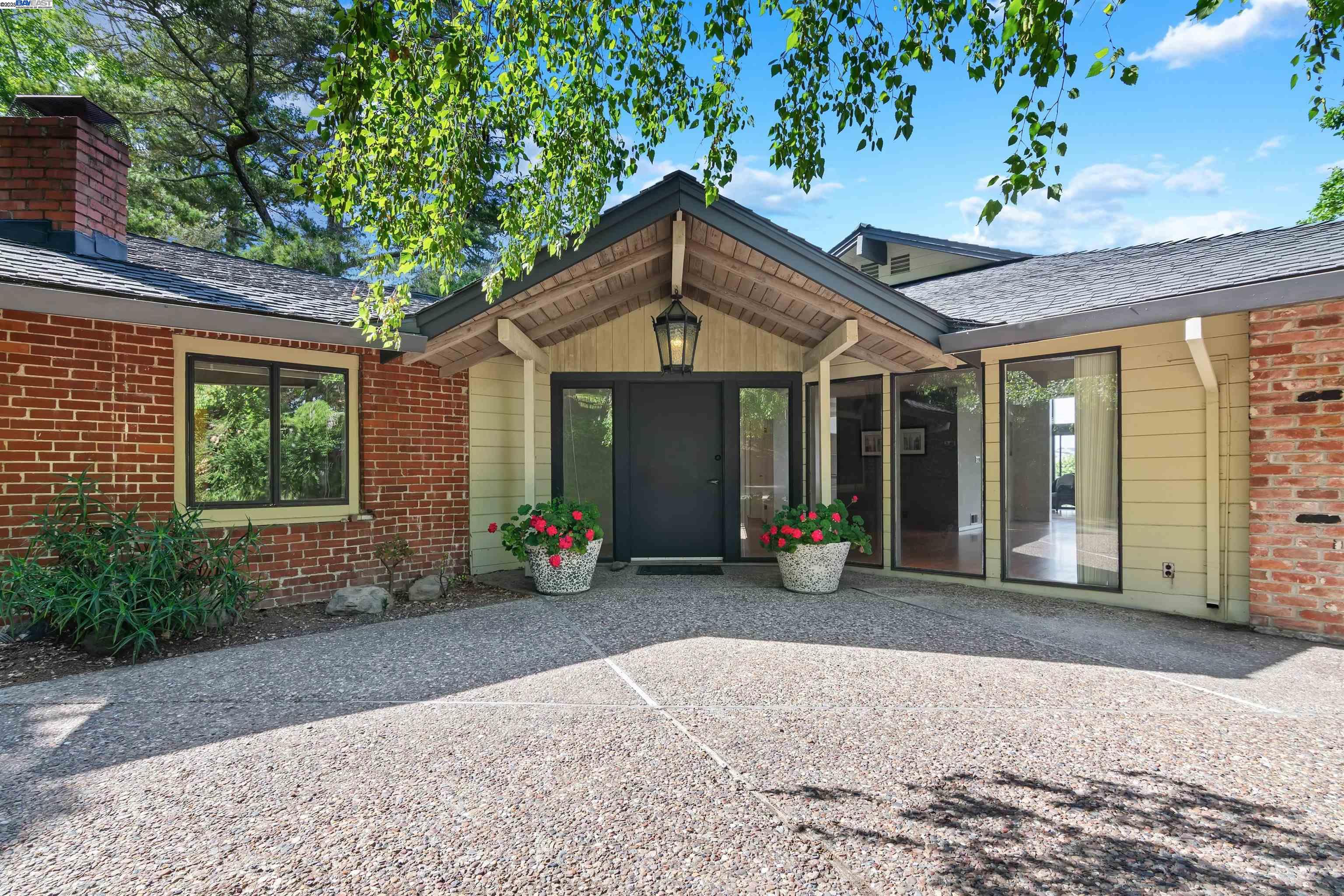 26 Marston Road Orinda, CA 94563 - Photo 1 of 1 a view of a house with patio and a garden