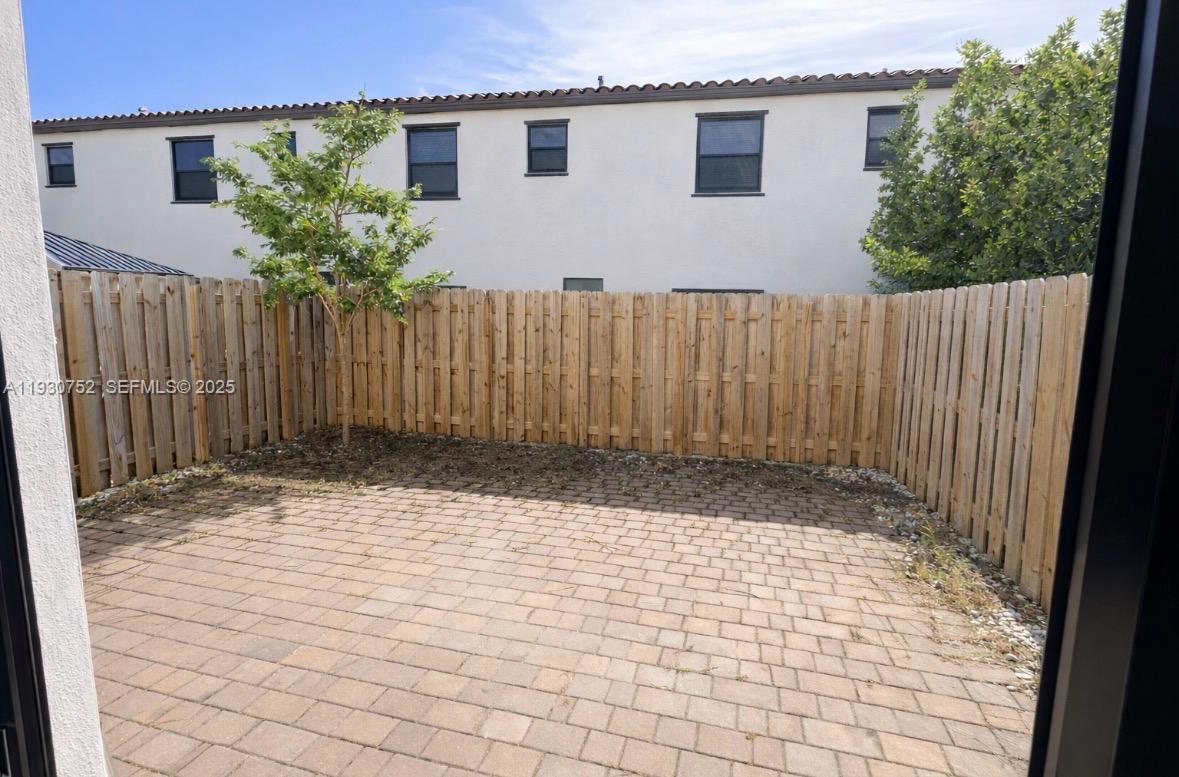 11956 Southwest 244th Lane, Unit 11956 Homestead, FL 33032 - Photo 7 of 7 a view of a backyard