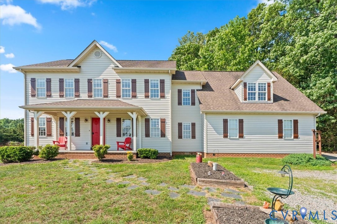 3137 Trenholm Road Powhatan, VA 23139 - Photo 52 of 72 a front view of a house with garden