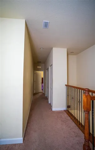 a view of hallway with livingroom