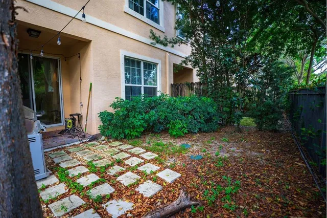 a view of backyard with a patio