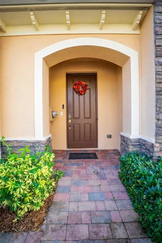 a front view of a house with a blue gate