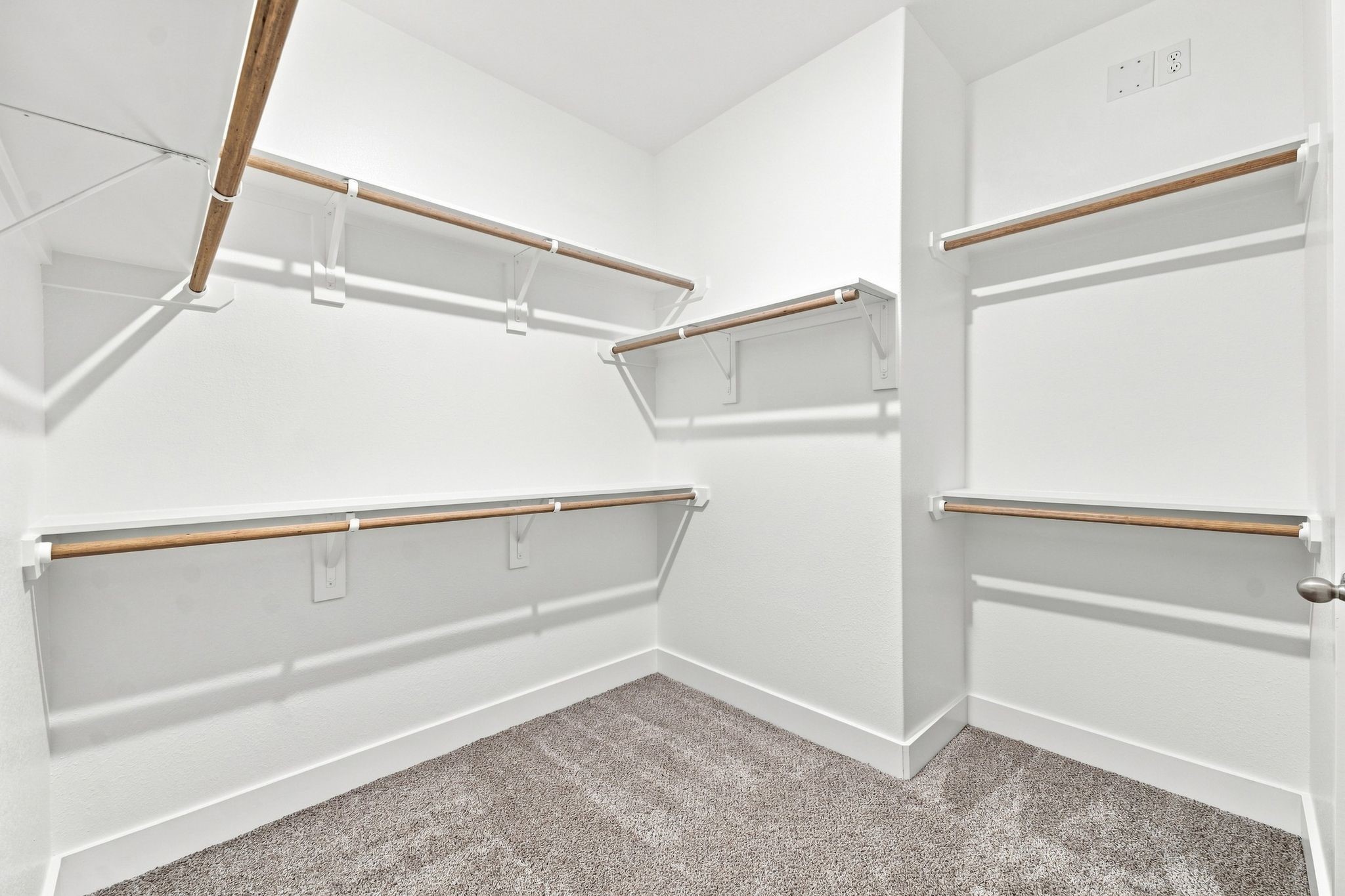 6057 Cebra Street Houston, TX 77091 - Photo 35 of 42 Another view of the spacious primary walk-in closet highlighting the generous built-in storage and hanging space. Photos are from a different property with a similar floor plan. Finishes, features, and orientation may vary.