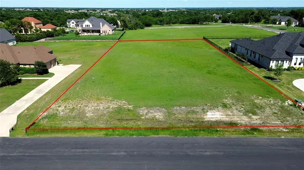a view of a golf course with an outdoor space
