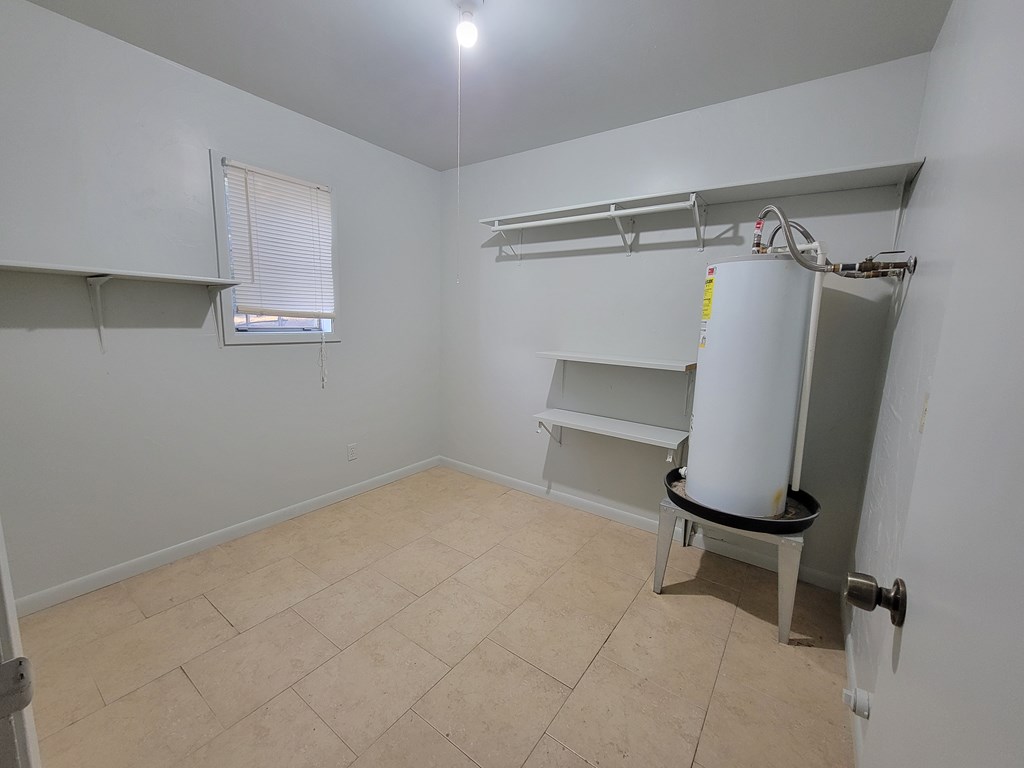 109 7th Street Ingram, TX 78025 - Photo 12 of 15 a view of a room with racks on the wall