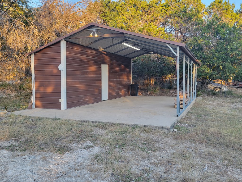 109 7th Street Ingram, TX 78025 - Photo 14 of 15 a view of a house with a small yard and a large tree