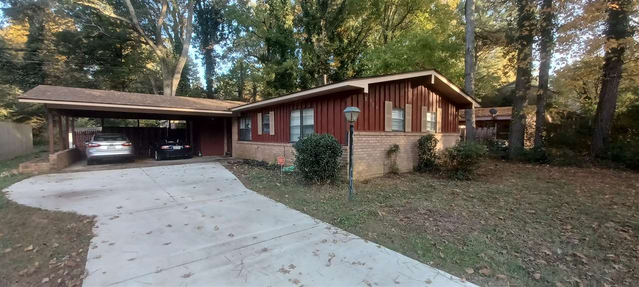 2920 Invergarry Road Memphis, TN 38128 - Photo 1 of 18 a view of a house that has a small yard and large trees