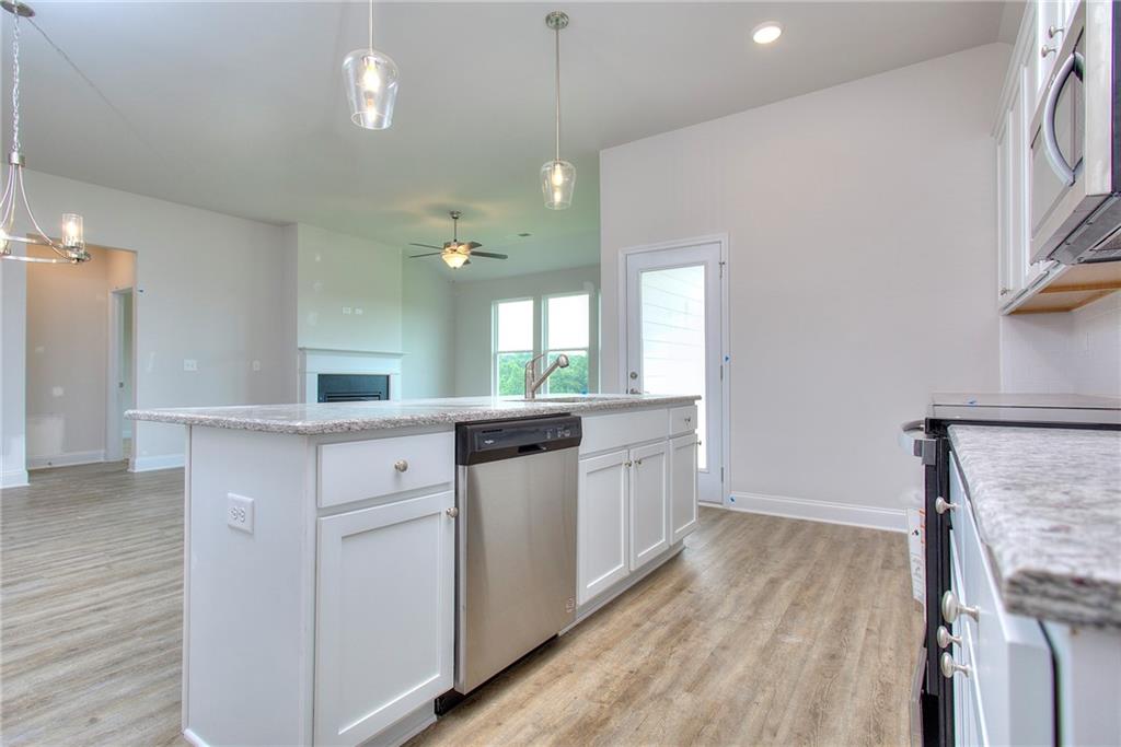 139 Swallowtail Lane Homer, GA 30547 - Photo 11 of 33 a kitchen with a sink and stove