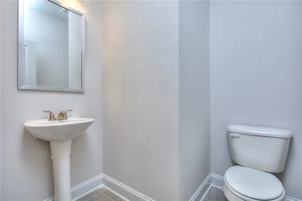 an empty room with a window and a ceiling fan