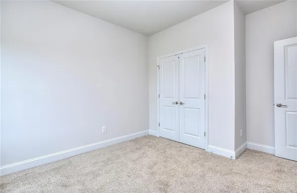 a house view with swimming pool in front of it